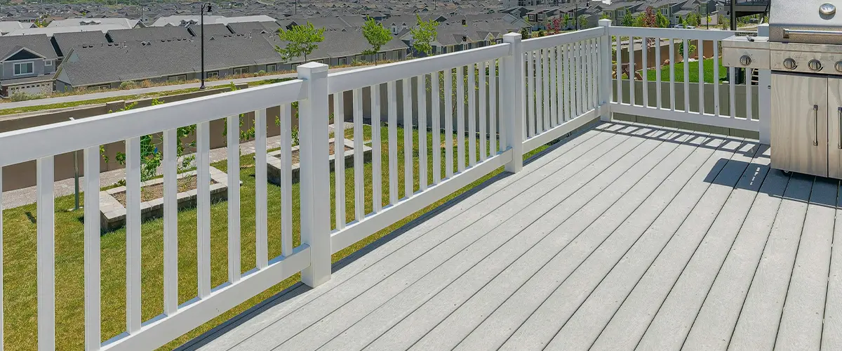 Aluminum white railing with gray composite decking