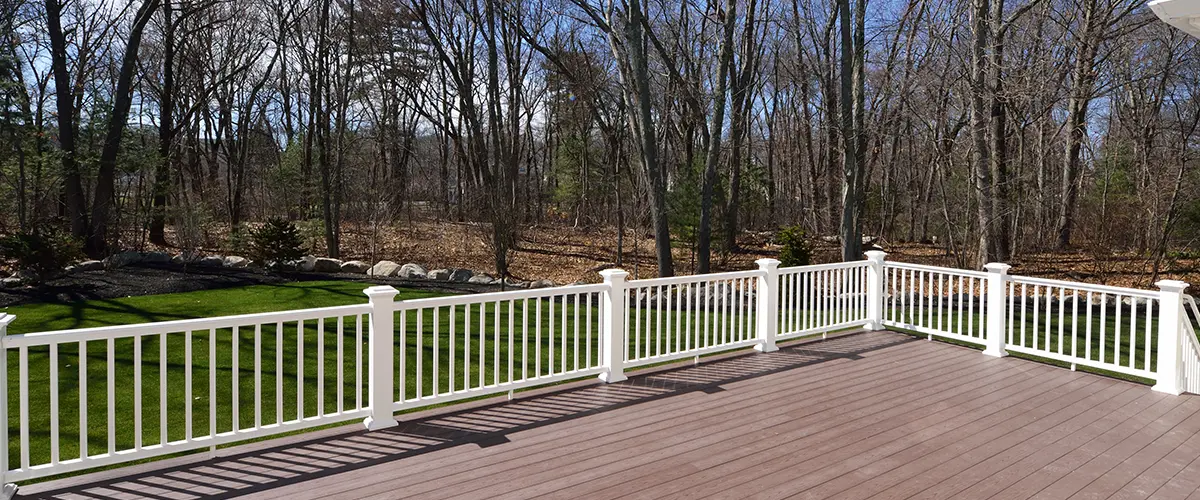 White aluminum railing on a brown composite deck